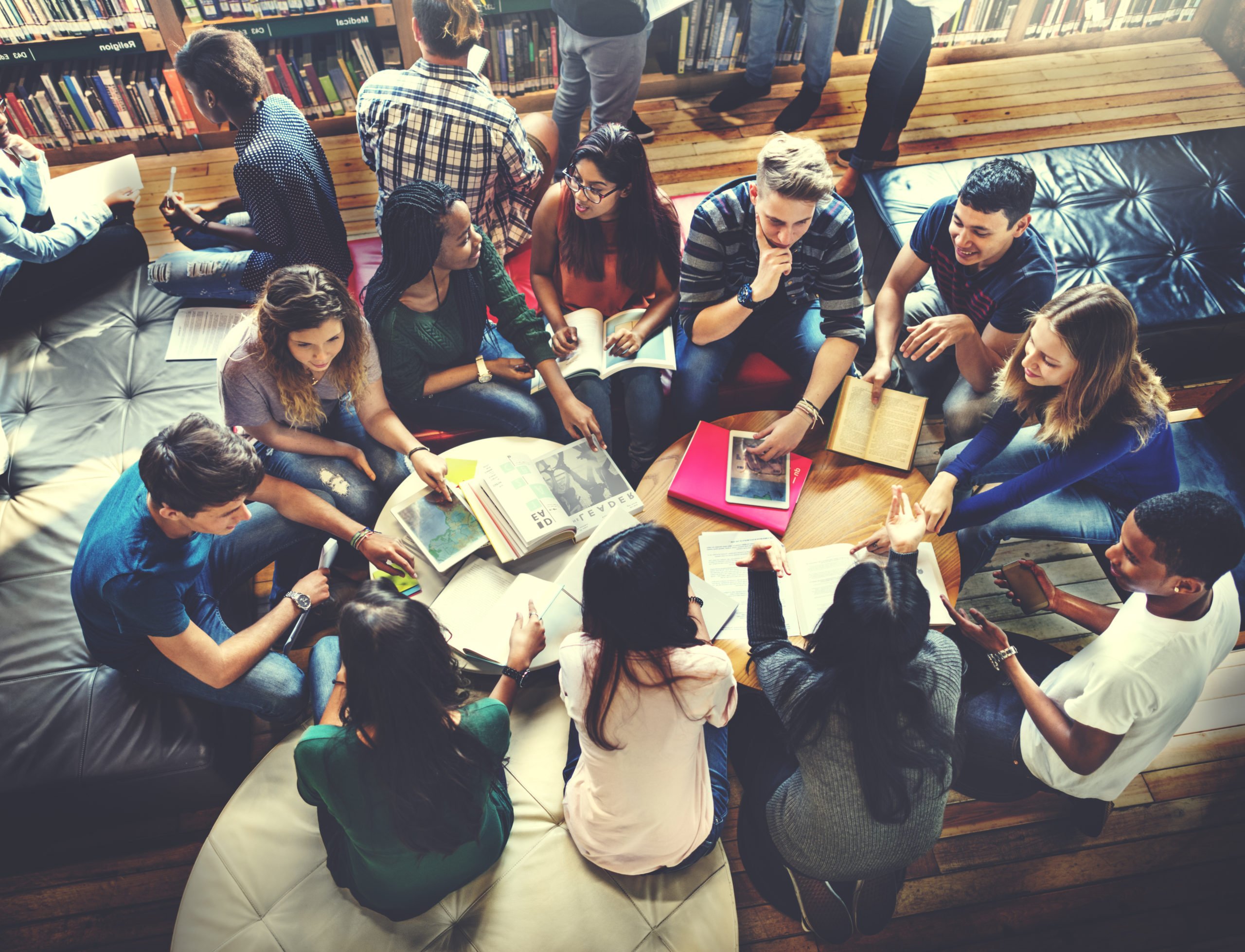 students-in-a-group-studying-in-a-library