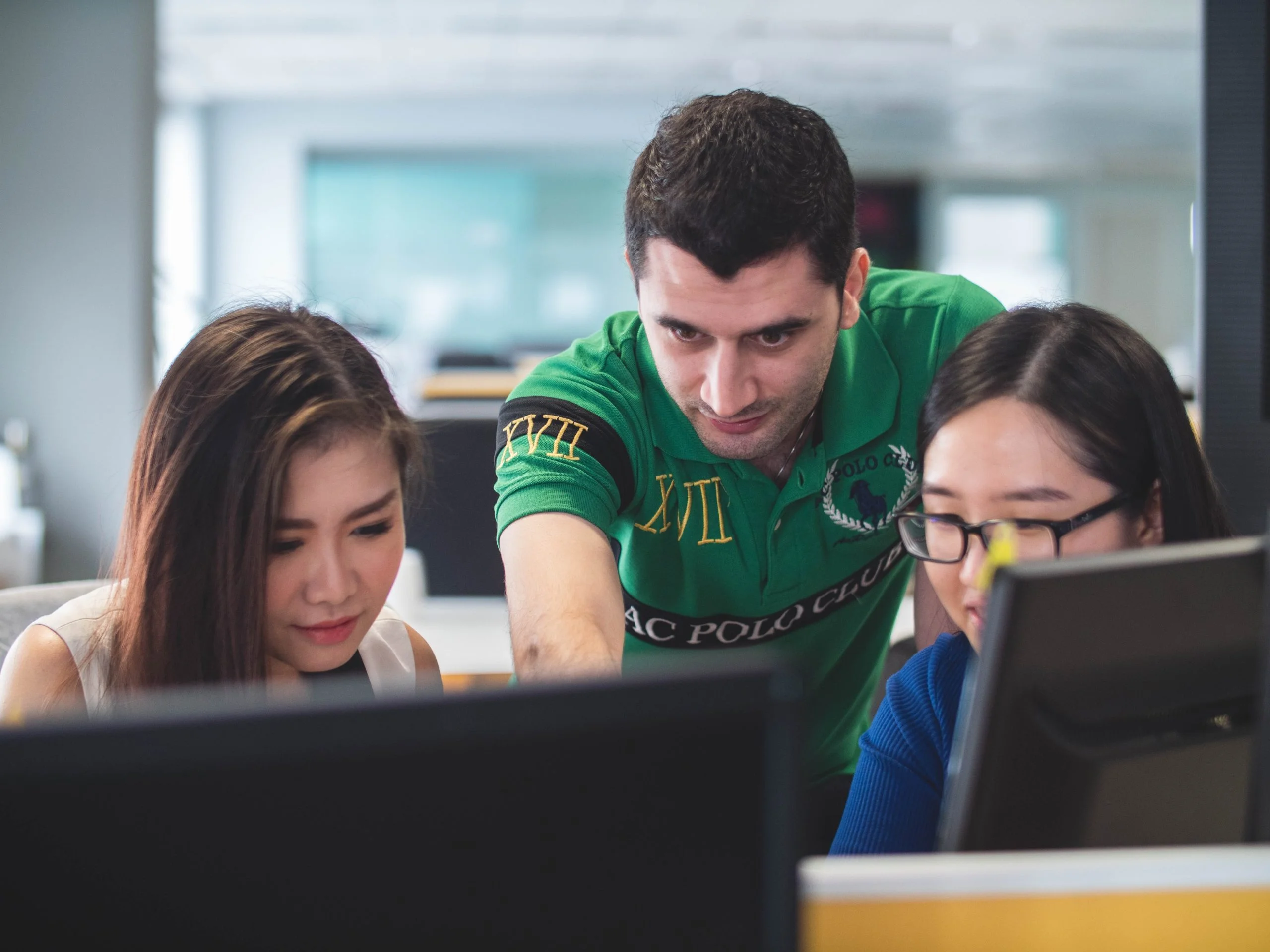 diverse-college-students-on-computers-working-together